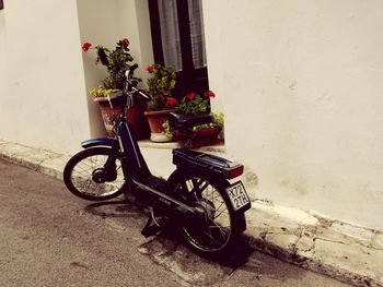 Bicycles parked against wall