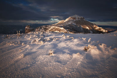 Scenic view of snow covered landscape against sky