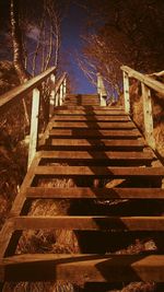 Staircase in city at night