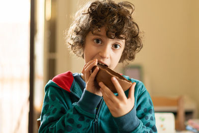 Children eating chocolate easter egg