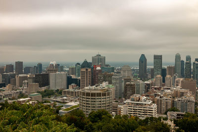 Modern buildings in city against sky