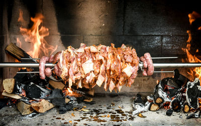 High angle view of meat on barbecue grill