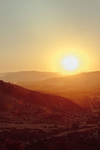 Scenic view of silhouette landscape against clear sky during sunset