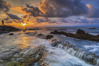 Scenic view of sea against sky during sunset