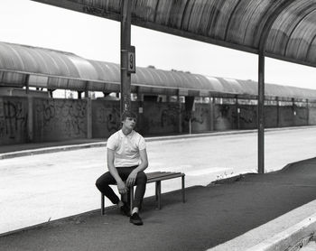 Full length of woman standing by railing