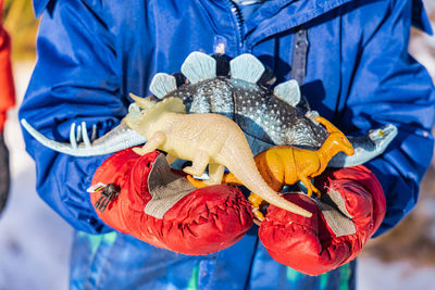 Close-up of man holding toy