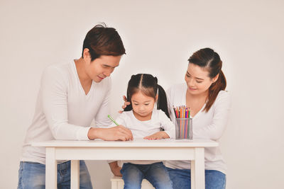 Cute girl studying at table