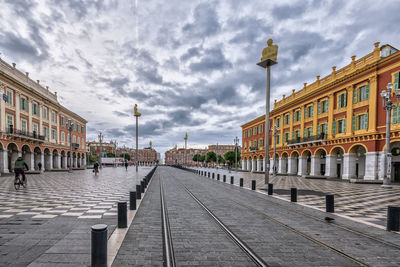 Street amidst buildings against sky