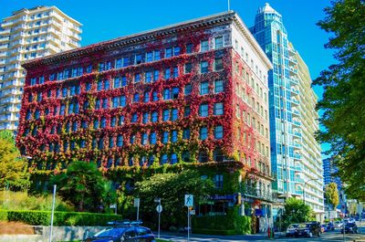 Low angle view of buildings against clear blue sky