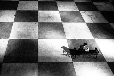 High angle view of man sitting on bicycle