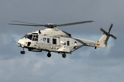 Low angle view of helicopter against clear sky