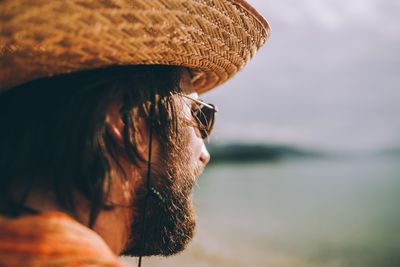 Close-up portrait of man wearing hat