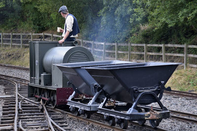 Man standing in rail transportation