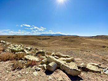 Scenic view of arid landscape against sky