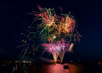 Firework display at night