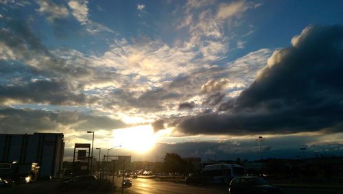 Road against cloudy sky at sunset