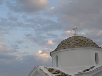 Low angle view of church against cloudy sky