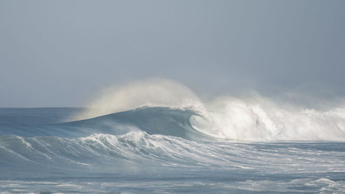 Sea waves against clear sky