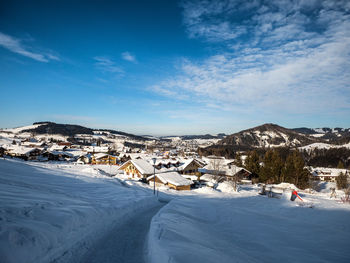 Scenic view of snow covered mountains against sky