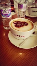 Close-up of coffee cup on table