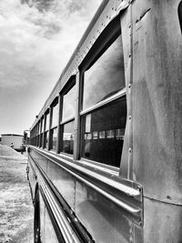 Train at railroad station against sky