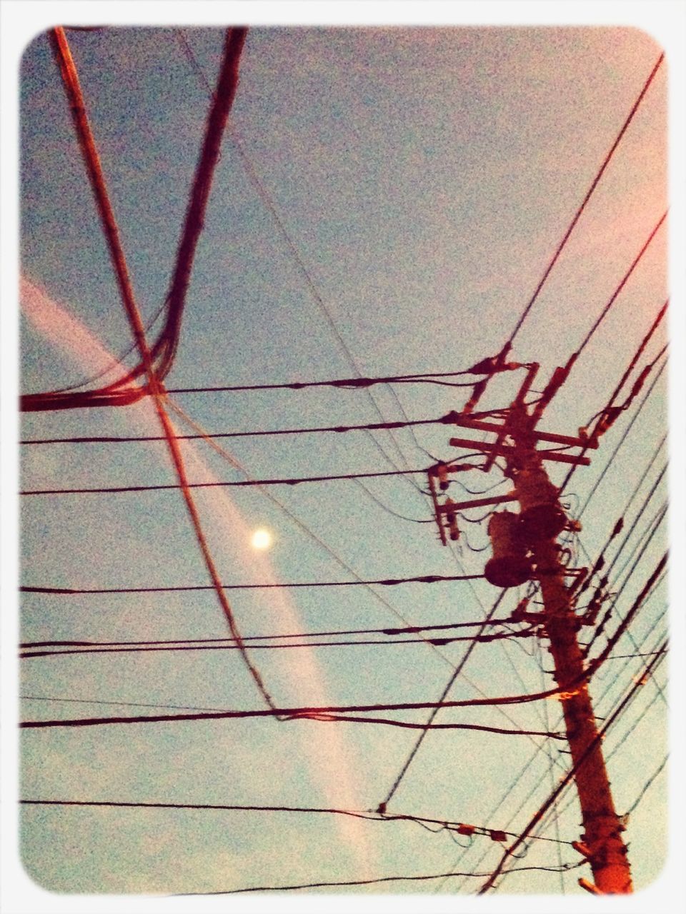 transfer print, low angle view, auto post production filter, power line, sky, cable, electricity, electricity pylon, power supply, sunlight, connection, outdoors, no people, built structure, day, sun, nature, power cable, architecture, silhouette