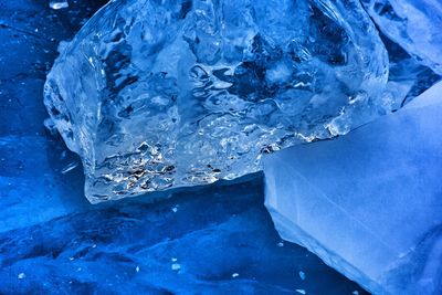 Close-up of ice crystals against blue background