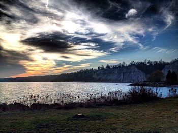 Scenic view of lake against cloudy sky