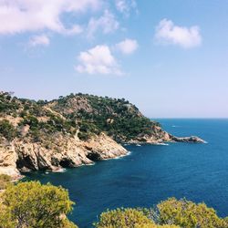 Scenic view of sea against blue sky