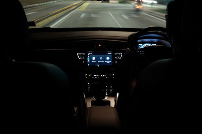 Cars moving on road seen through car windshield