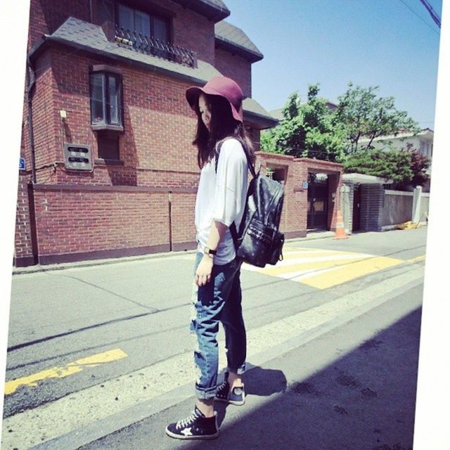 full length, casual clothing, building exterior, lifestyles, young adult, street, built structure, architecture, road, person, transportation, leisure activity, front view, sunlight, city, young women, standing, walking