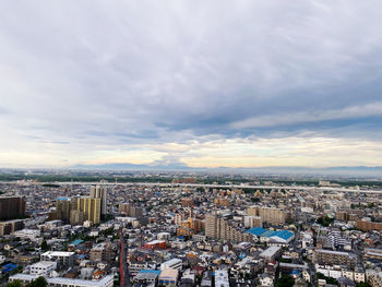 High angle view of buildings against sky in city