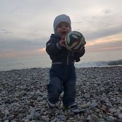 Full length of man standing on beach