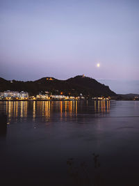 Scenic view of illuminated mountains against sky at night