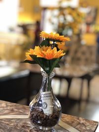 Close-up of flower vase on table