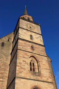 Low angle view of building against blue sky