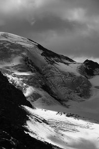 Scenic view of mountains against sky during winter