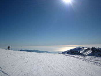 Scenic view of snow covered mountain against sky