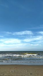 Scenic view of sea against blue sky