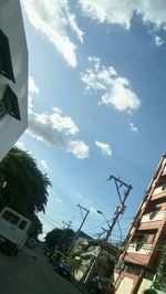 Low angle view of building against cloudy sky