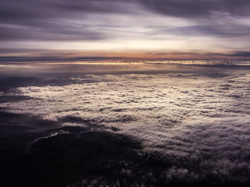 Aerial view of sea against sky during sunset