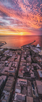 High angle view of buildings against sky during sunset