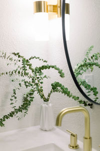 Close-up of gold sink in bathroom