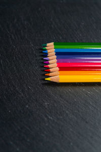 High angle view of multi colored pencils on table