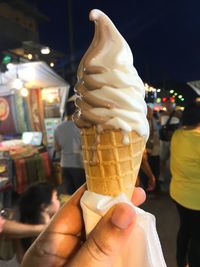 Cropped image of hand holding ice cream
