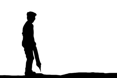 Side view of silhouette man against white background