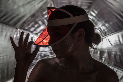 Close-up of woman wearing red cap