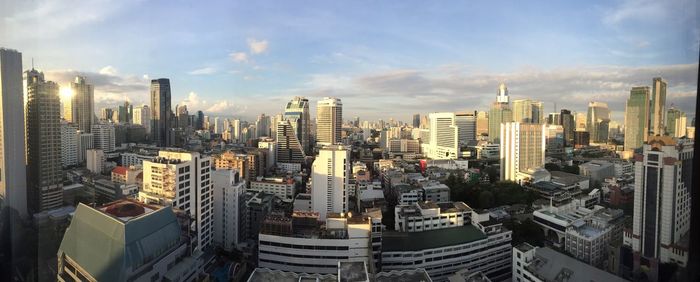 Illuminated cityscape against sky