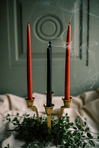 Smoke and embers. close up of a freshly blown-out candle, creating a mystic and witch vibe.