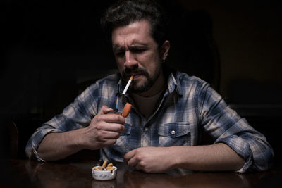 Portrait of man holding ice cream